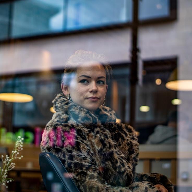 Avery Lin, Lead Design Curator at Season Almystic Archive, reviewing corporate floral arrangements